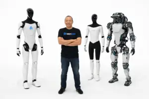 Three humanoid robots — Figure AI, Tesla Optimus, and Boston Dynamics Atlas — standing apart on a white background, representing the 2026 robotics innovation landscape.